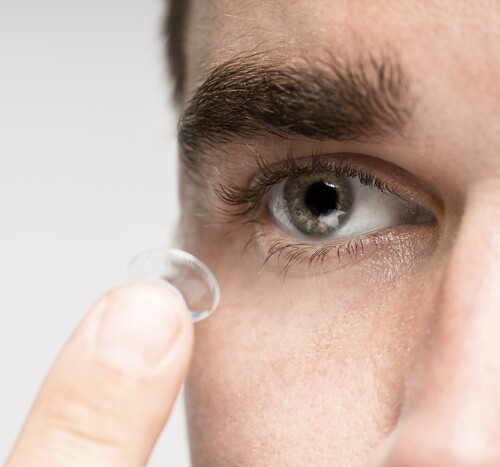 Man holding eye contact close up